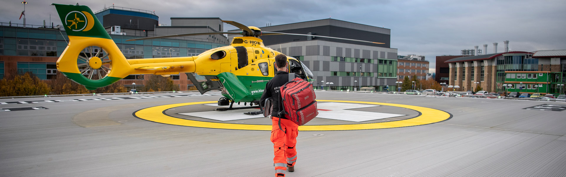 Hampshire Air Ambulance crew walking to Helicopter 