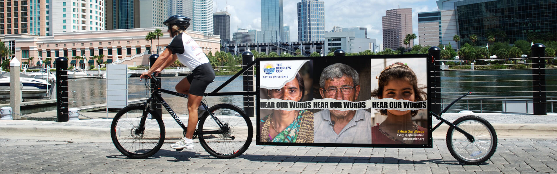 The Peoples COP advertising campaign 'Hear our words' on the back of a bike