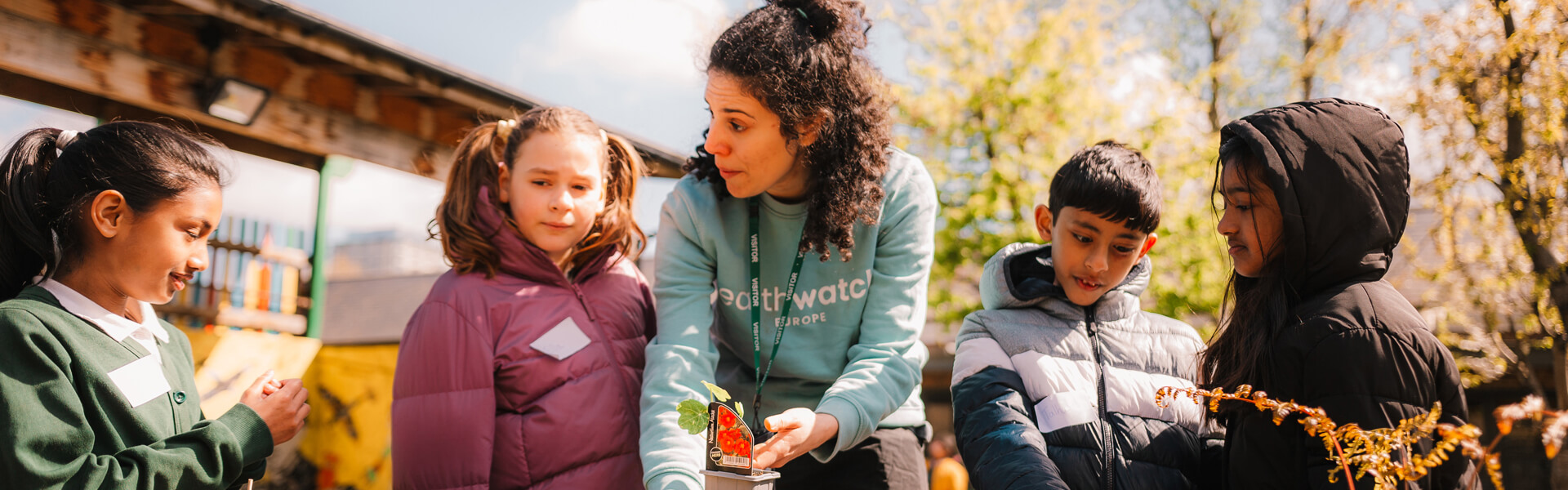 Earthwatch charity working with a group of children