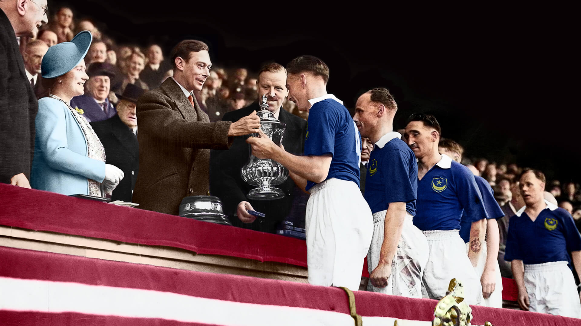 Portsmouth Football team receiving the FA Cup trophy from King George VI.