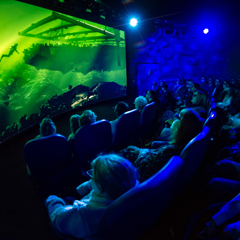 Audience enjoying the 'Dive the Mary Rose: 4D Experience' in the screening room.
