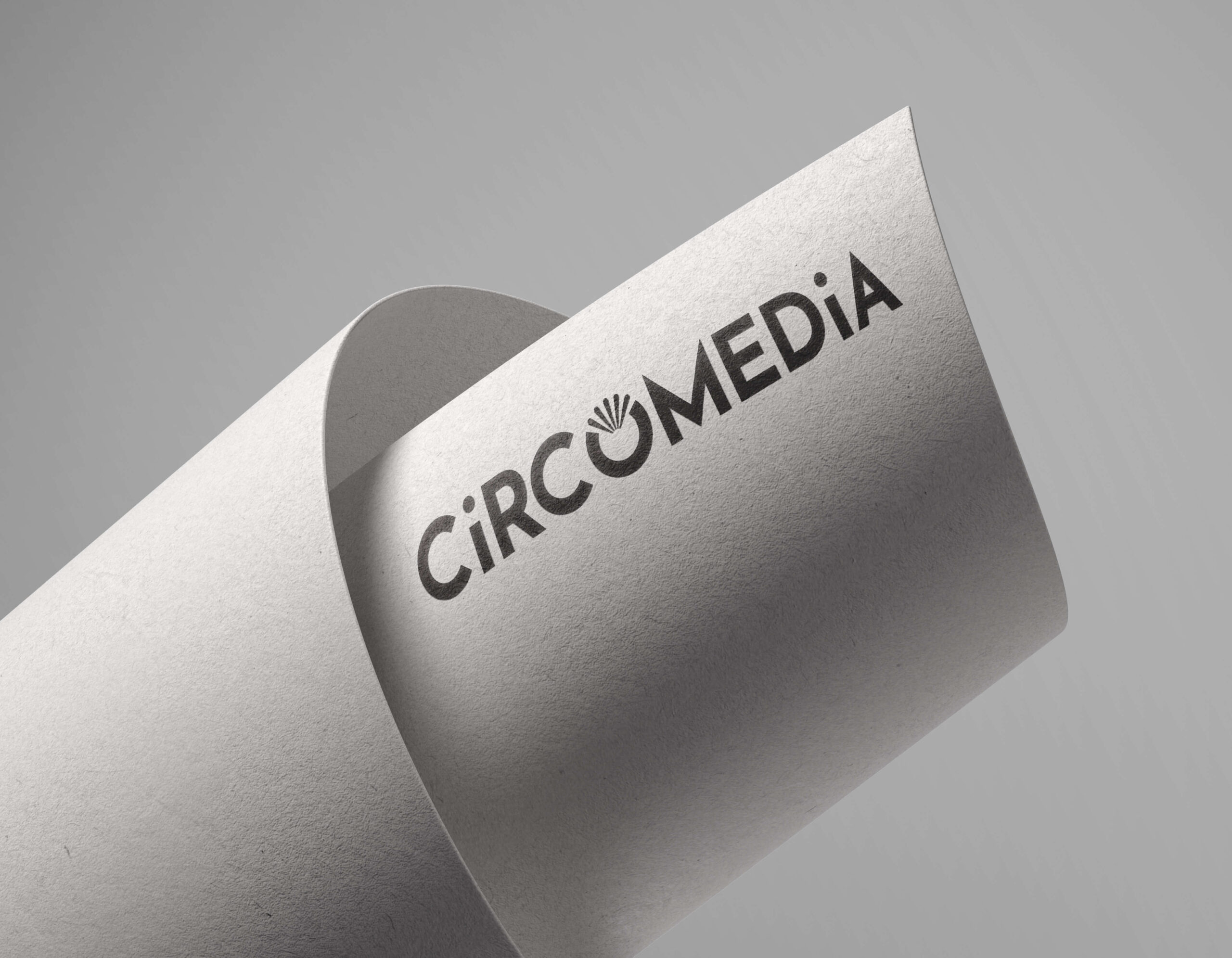 Circomedia full logo mock-up on a piece of white paper