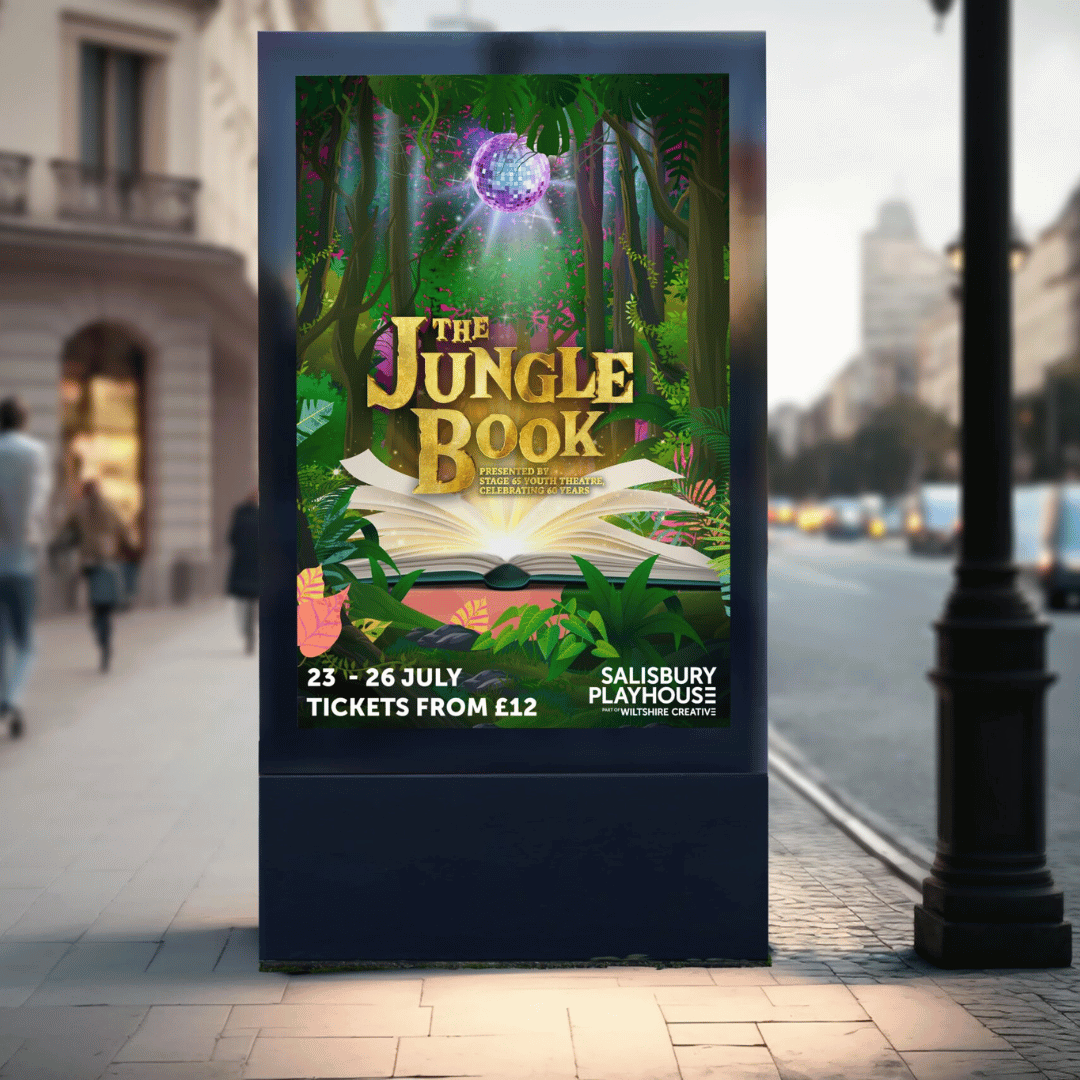Jungle book creative shown on a foot path next to a road.