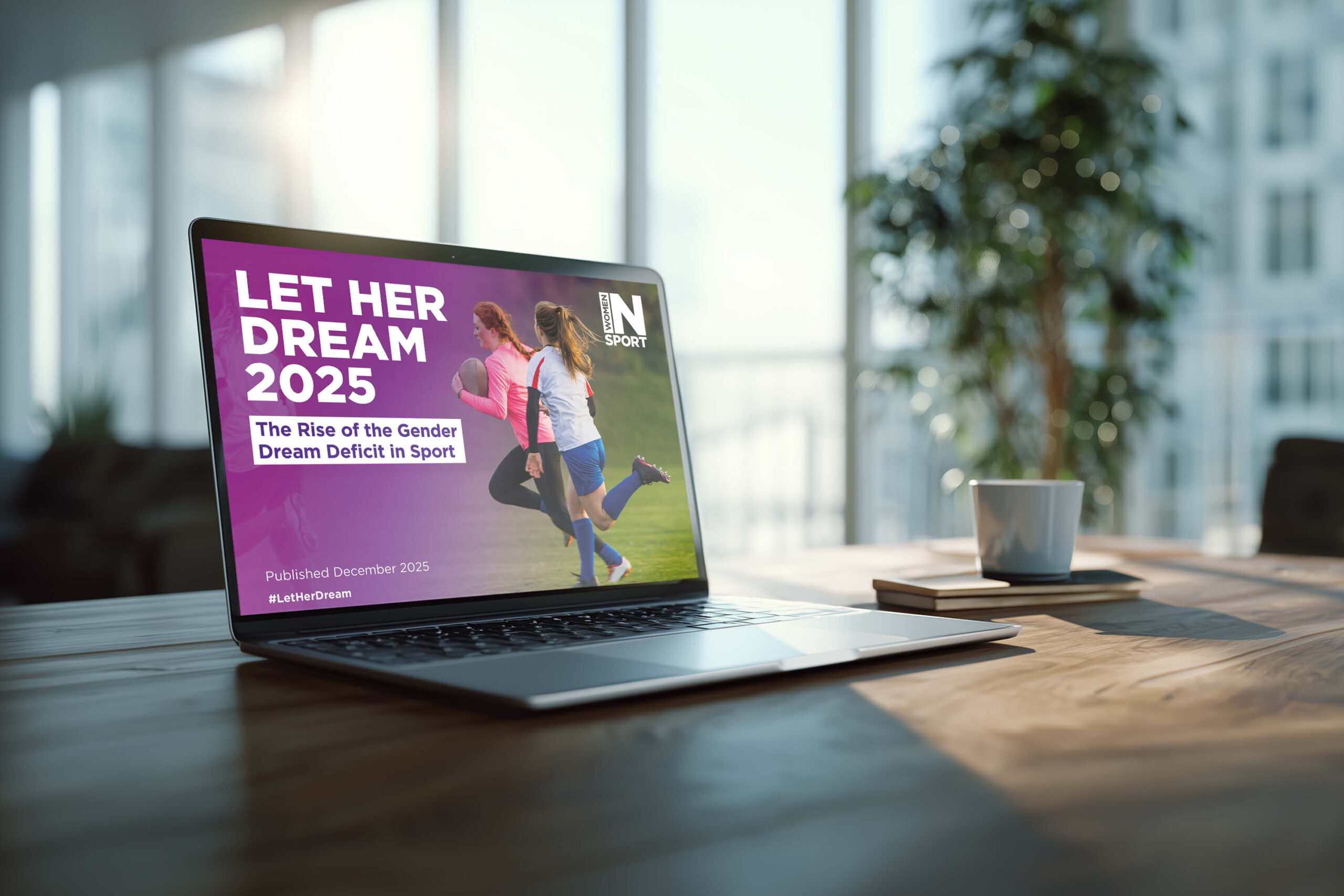 A mock-up showing the Women in Sport report digitally designed on a laptop screen.