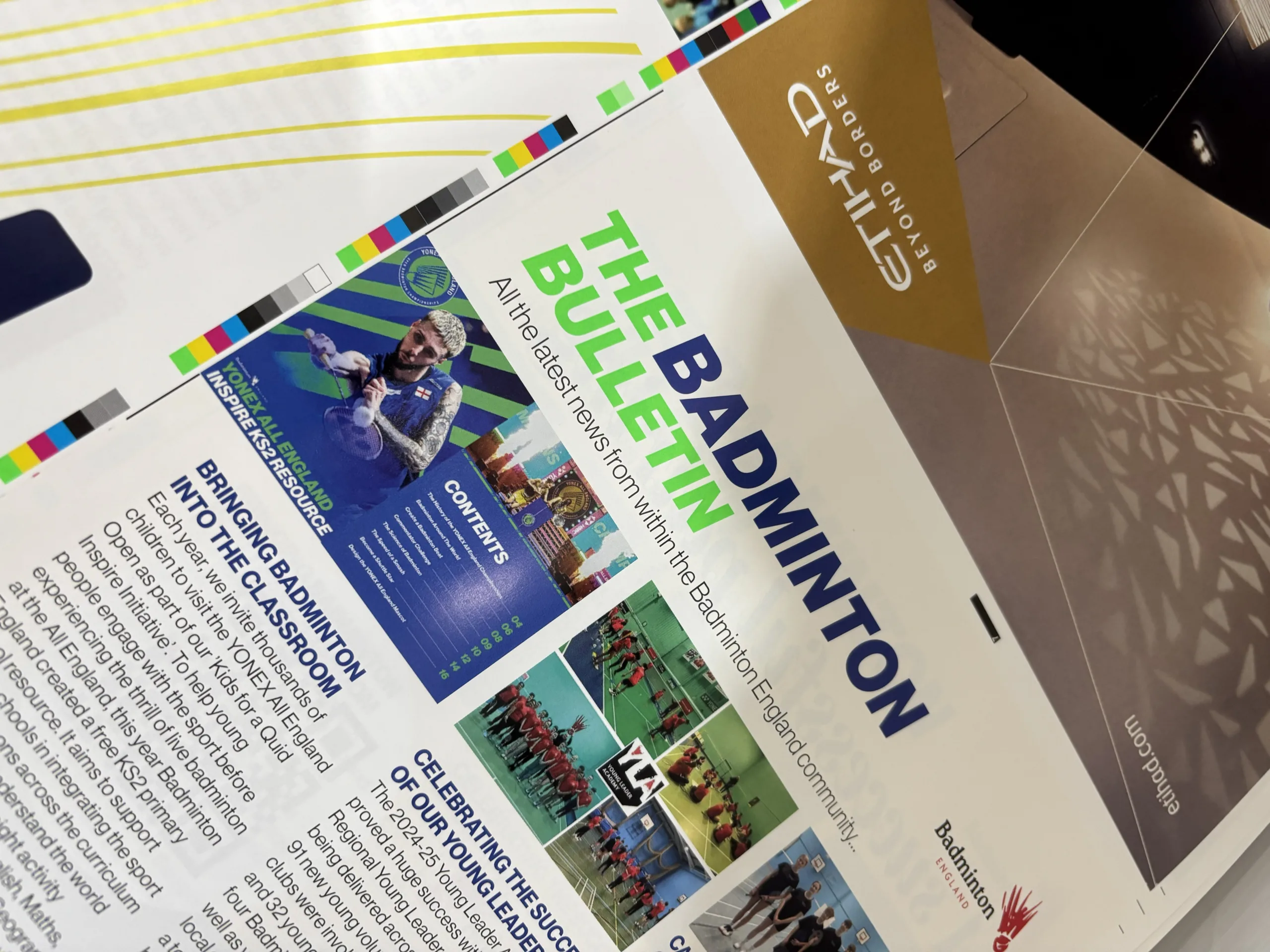 A photo of a printed spread in the factory of the Yonex All England Open Programme in the Bishops Printers Factory.