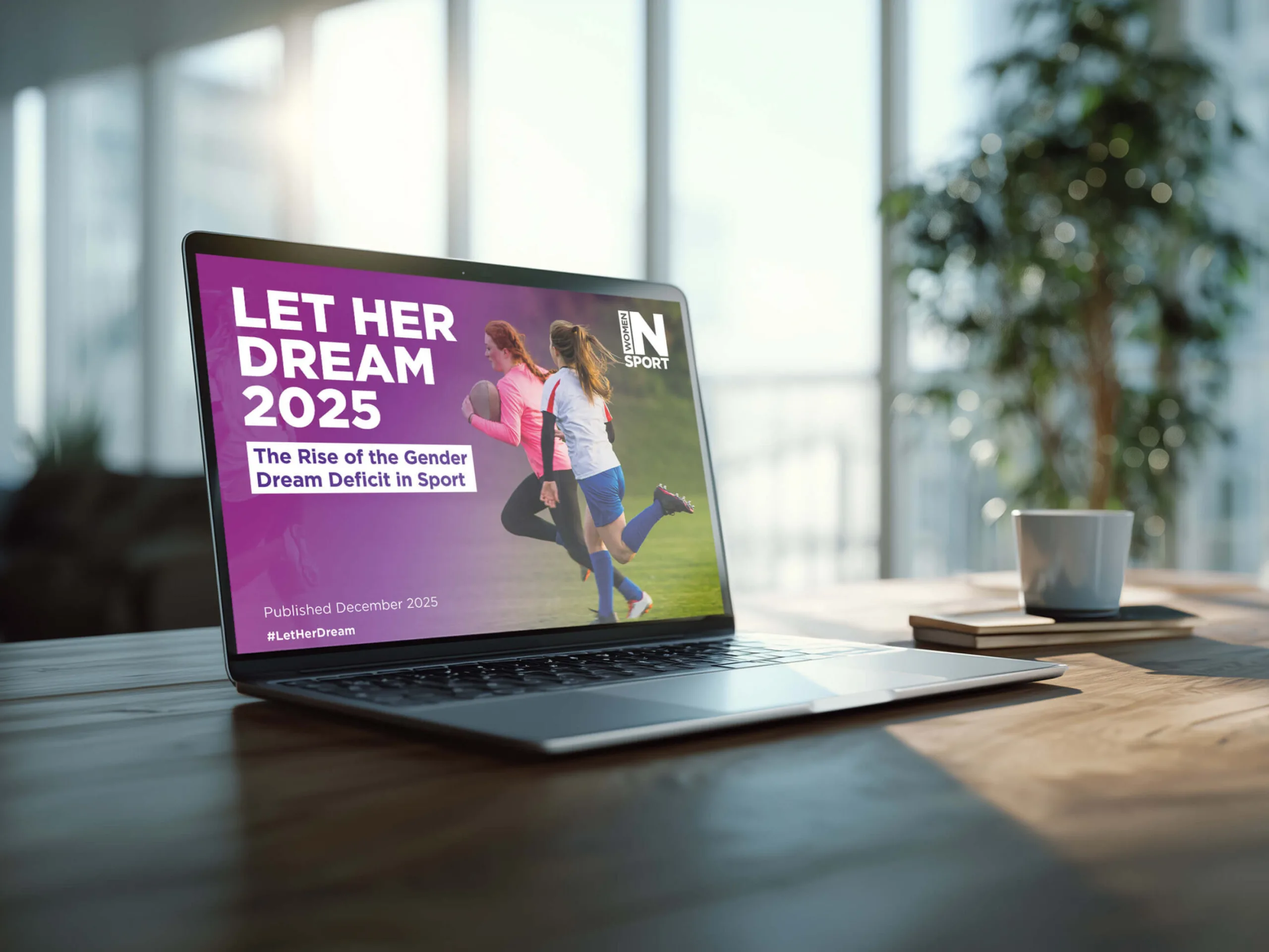 A mock-up showing the Women in Sport report digitally designed on a laptop screen.